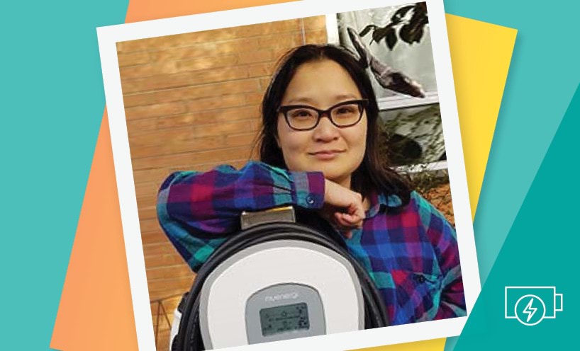 Woman standing with solar battery