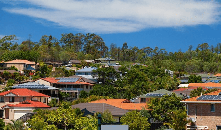 Houses with solar panels fitted to the roofs. 