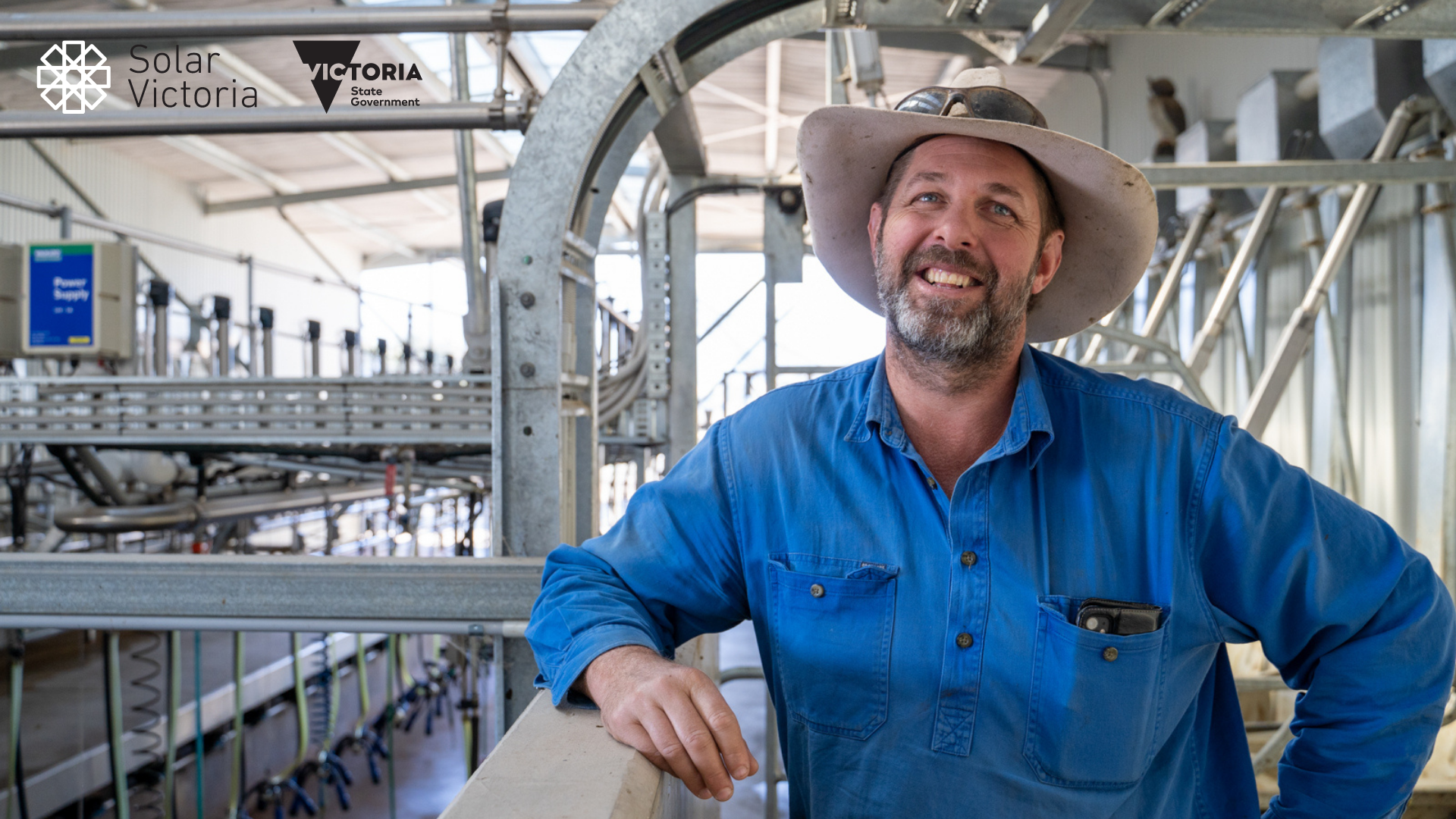 Farmer with hat smiling at camera